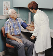 Photo of a doctor taking a patient’s blood pressure