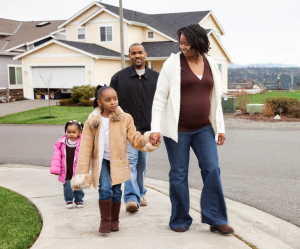Photo of family taking a walk in their neighborhood.