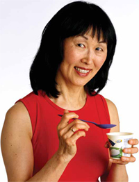 Making good food choice, woman eating yogurt.